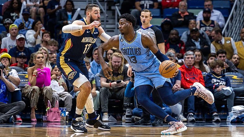 Apr 5, 2023; New Orleans, Louisiana, USA; Memphis Grizzlies forward Jaren Jackson Jr. (13) dribbles against New Orleans Pelicans center Jonas Valanciunas (17) during the first half at Smoothie King Center. Mandatory Credit: Stephen Lew-USA TODAY Sports