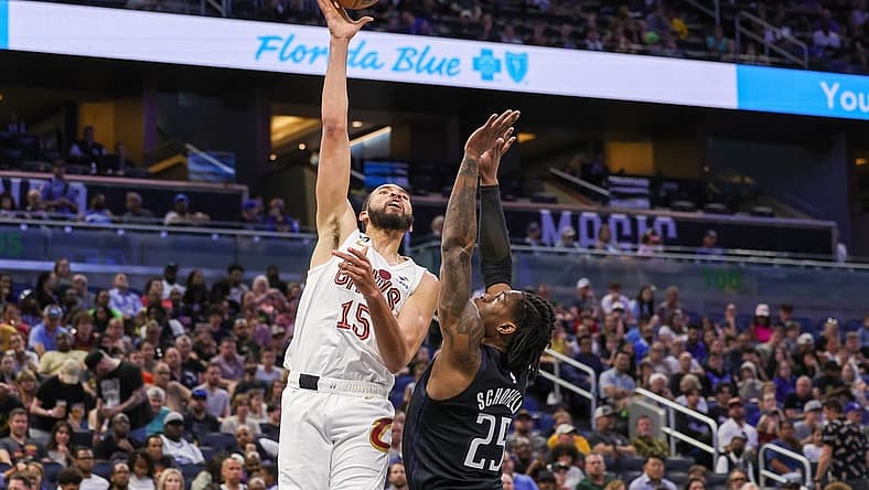 Apr 6, 2023; Orlando, Florida, USA; Cleveland Cavaliers forward Isaiah Mobley (15) shoots the ball over Orlando Magic forward Admiral Schofield (25) during the second quarter at Amway Center. Mandatory Credit: Mike Watters-USA TODAY Sports