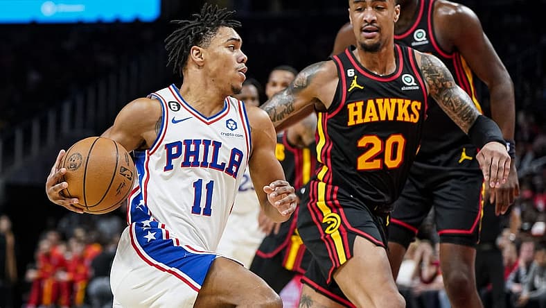 Apr 7, 2023; Atlanta, Georgia, USA; Philadelphia 76ers guard Jaden Springer (11) drives to the basket against Atlanta Hawks forward John Collins (20) during the first half at State Farm Arena. Mandatory Credit: Dale Zanine-USA TODAY Sports