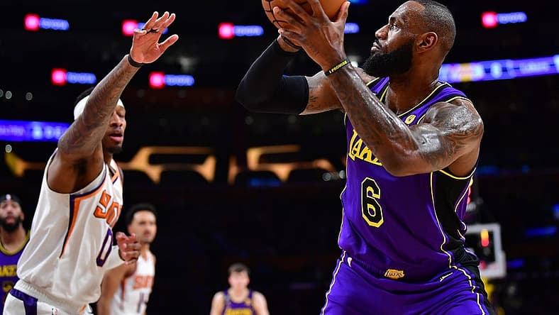 Apr 7, 2023; Los Angeles, California, USA; Los Angeles Lakers forward LeBron James (6) shoots against Phoenix Suns forward Torrey Craig (0) during the first half at Crypto.com Arena. Mandatory Credit: Gary A. Vasquez-USA TODAY Sports