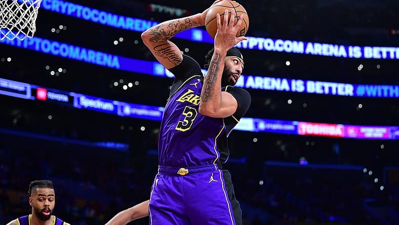 Apr 7, 2023; Los Angeles, California, USA; Los Angeles Lakers forward Anthony Davis (3) gets the rebound against the Phoenix Suns during the second half at Crypto.com Arena. Mandatory Credit: Gary A. Vasquez-USA TODAY Sports