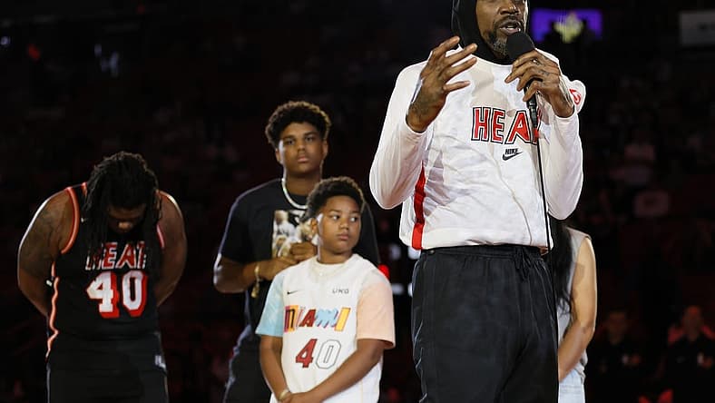 Apr 9, 2023; Miami, Florida, USA; Miami Heat forward Udonis Haslem (40) talks in front of his family during a ceremony to celebrate his last regular season game prior to the game against the Orlando Magic at Kaseya Center. Mandatory Credit: Sam Navarro-USA TODAY Sports