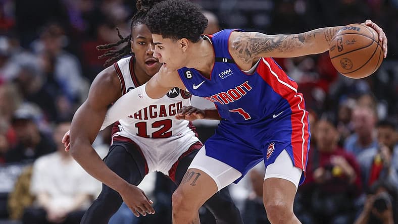 Apr 9, 2023; Chicago, Illinois, USA; Chicago Bulls guard Ayo Dosunmu (12) defends against Detroit Pistons guard Killian Hayes (7) during the first half at United Center. Mandatory Credit: Kamil Krzaczynski-USA TODAY Sports