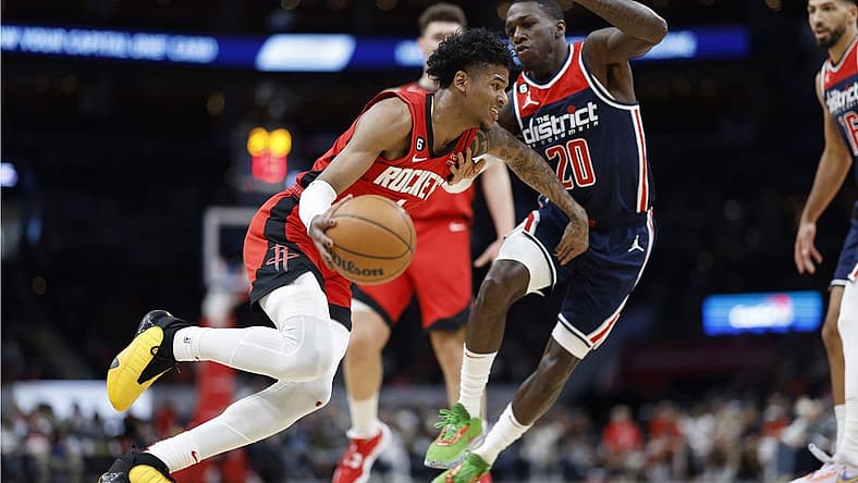 Apr 9, 2023; Washington, District of Columbia, USA; Houston Rockets guard Jalen Green (4) dribbles the ball as Washington Wizards guard Kendrick Nunn (20) defends in the second quarterat Capital One Arena. Mandatory Credit: Geoff Burke-USA TODAY Sports