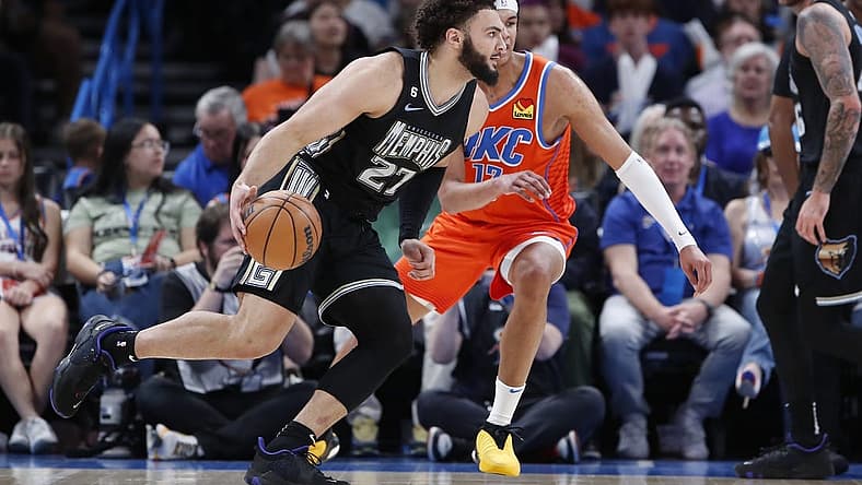 Apr 9, 2023; Oklahoma City, Oklahoma, USA; Memphis Grizzlies forward David Roddy (27) drives to the basket against Oklahoma City Thunder forward Ousmane Dieng (13) during the first half at Paycom Center. Mandatory Credit: Alonzo Adams-USA TODAY Sports