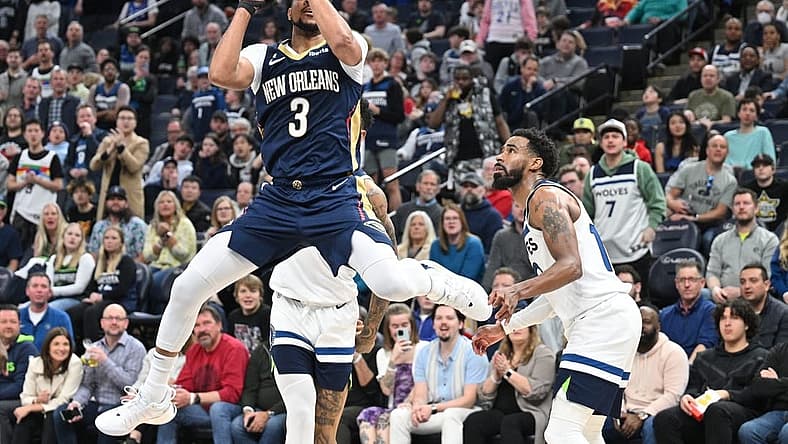 Apr 9, 2023; Minneapolis, Minnesota, USA; New Orleans Pelicans guard CJ McCollum (3) shoots the ball as Minnesota Timberwolves guard Mike Conley (10) looks on during the third quarter at Target Center. Mandatory Credit: Jeffrey Becker-USA TODAY Sports