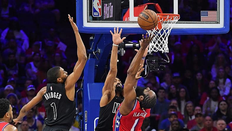 Apr 15, 2023; Philadelphia, Pennsylvania, USA; Philadelphia 76ers guard James Harden (1) reaches for ball forward Mikal Bridges (1) during the first quarter of game one of the 2023 NBA playoffs at Wells Fargo Center. Mandatory Credit: Eric Hartline-USA TODAY Sports