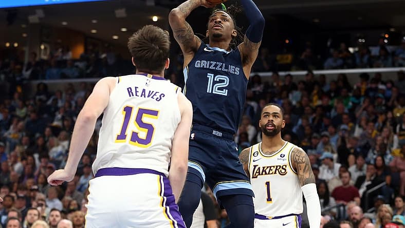 Apr 16, 2023; Memphis, Tennessee, USA; Memphis Grizzlies guard Ja Morant (12) shoots during the second half during game one of the 2023 NBA playoffs against the Los Angeles Lakers at FedExForum. Mandatory Credit: Petre Thomas-USA TODAY Sports