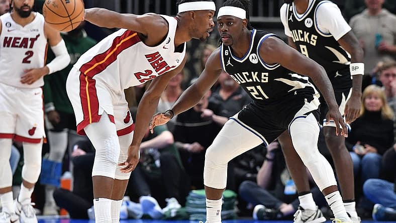 Apr 16, 2023; Milwaukee, Wisconsin, USA; Miami Heat forward Jimmy Butler (22) against Milwaukee Bucks forward Khris Middleton (22) in the second half during game one of the 2023 NBA Playoffs at Fiserv Forum. Mandatory Credit: Michael McLoone-USA TODAY Sports