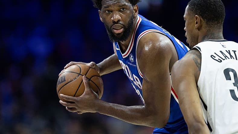 Apr 17, 2023; Philadelphia, Pennsylvania, USA; Philadelphia 76ers center Joel Embiid (21) controls the ball against Brooklyn Nets center Nic Claxton (33) during the third quarter in game two of the 2023 NBA playoffs at Wells Fargo Center. Mandatory Credit: Bill Streicher-USA TODAY Sports