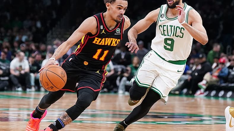 Apr 18, 2023; Boston, Massachusetts, USA; Atlanta Hawks guard Trae Young (11) drives the ball against Boston Celtics guard Derrick White (9) in the third quarter during game two of the 2023 NBA playoffs at TD Garden. Mandatory Credit: David Butler II-USA TODAY Sports