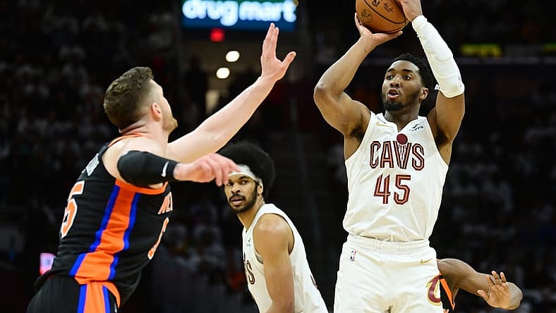 Apr 18, 2023; Cleveland, Ohio, USA; Cleveland Cavaliers guard Donovan Mitchell (45) shoots over the defense of New York Knicks center Isaiah Hartenstein (55) during the second half of game two of the 2023 NBA playoffs at Rocket Mortgage FieldHouse. Mandatory Credit: Ken Blaze-USA TODAY Sports