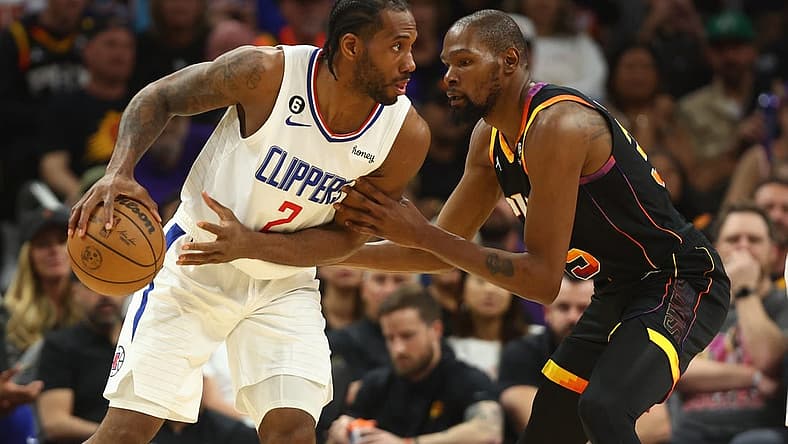 Apr 18, 2023; Phoenix, Arizona, USA; Los Angeles Clippers forward Kawhi Leonard (2) controls the ball against Phoenix Suns forward Kevin Durant (35) in the second half during game two of the 2023 NBA playoffs at Footprint Center. Mandatory Credit: Mark J. Rebilas-USA TODAY Sports