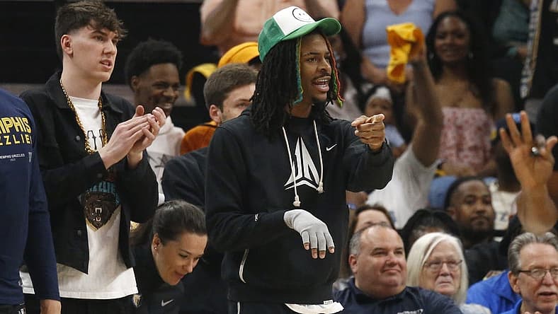 Apr 19, 2023; Memphis, Tennessee, USA; Memphis Grizzlies guard Ja Morant (12) gives direction from the bench during the first half during game two of the 2023 NBA playoffs against the Los Angeles Lakers at FedExForum. Mandatory Credit: Petre Thomas-USA TODAY Sports