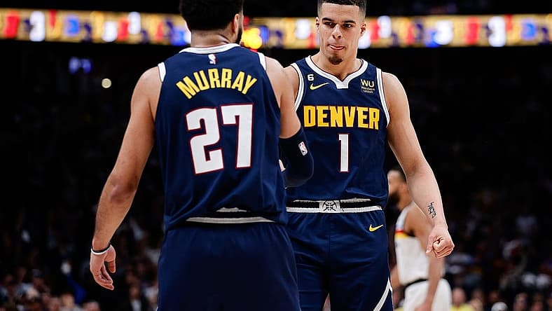 Apr 19, 2023; Denver, Colorado, USA; Denver Nuggets forward Michael Porter Jr. (1) reacts with guard Jamal Murray (27) in the fourth quarter during game two of the 2023 NBA Playoffs at Ball Arena. Mandatory Credit: Isaiah J. Downing-USA TODAY Sports