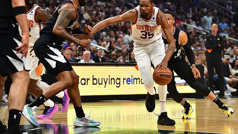 Apr 22, 2023; Los Angeles, California, USA; Phoenix Suns forward Kevin Durant (35) moves to the basket against Los Angeles Clippers forward Marcus Morris Sr. (8) during the first half in game four of the 2023 NBA playoffs at Crypto.com Arena. Mandatory Credit: Gary A. Vasquez-USA TODAY Sports