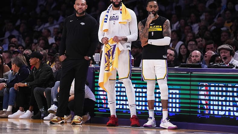 Apr 22, 2023; Los Angeles, California, USA; Los Angeles Lakers coach Darvin Ham (left), forward Anthony Davis (3) and guard D'Angelo Russell (1) react against the Memphis Grizzlies in the fourth quarter during game three of the 2023 NBA playoffs at Crypto.com Arena. Mandatory Credit: Kirby Lee-USA TODAY Sports
