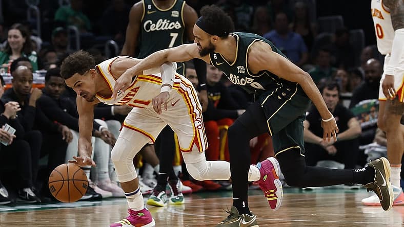 Apr 25, 2023; Boston, Massachusetts, USA; Atlanta Hawks guard Trae Young (11) gathers in a loose ball next to Boston Celtics guard Derrick White (9) during the third quarter of game five of the 2023 NBA playoffs at TD Garden. Mandatory Credit: Winslow Townson-USA TODAY Sports