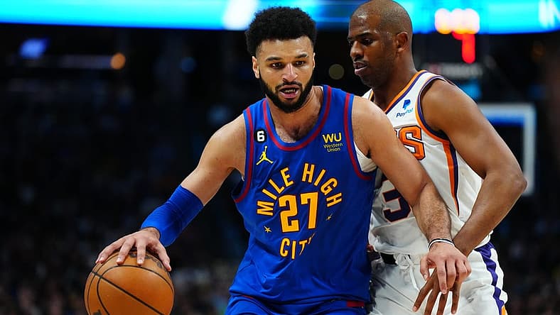 Apr 29, 2023; Denver, Colorado, USA; Denver Nuggets guard Jamal Murray (27) drives past Phoenix Suns guard Chris Paul (3) in the second half during game one of the 2023 NBA Playoffs at Ball Arena. Mandatory Credit: Ron Chenoy-USA TODAY Sports