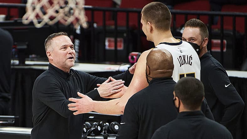 Nuggets head coach Michael Malone and center Nikola Jokic (15) were ignited by the media narrative around the Lakers after Game 1. Mandatory Credit: Troy Wayrynen-USA TODAY Sports