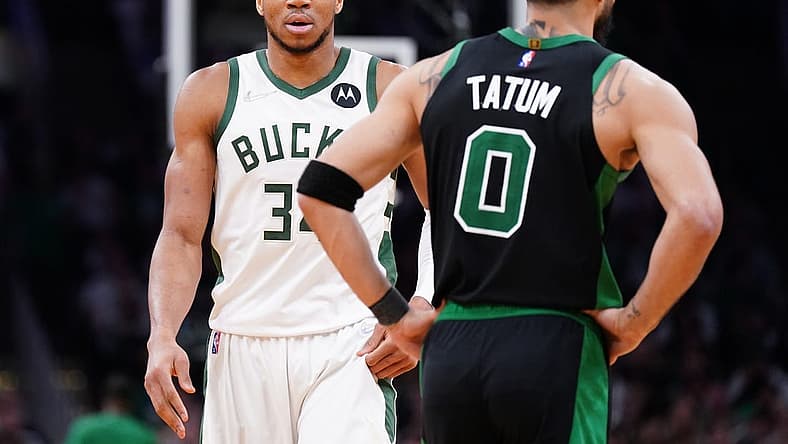 May 1, 2022; Boston, Massachusetts, USA; Milwaukee Bucks forward Giannis Antetokounmpo (34) and Boston Celtics forward Jayson Tatum (0) on the court in the second half during game one of the second round for the 2022 NBA playoffs at TD Garden. Mandatory Credit: David Butler II-USA TODAY Sports
