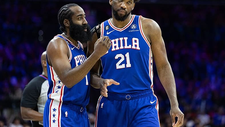Feb 1, 2023; Philadelphia, Pennsylvania, USA; Philadelphia 76ers guard James Harden (1) and center Joel Embiid (21) talks during a break in the fourth quarter against the Orlando Magic at Wells Fargo Center. Mandatory Credit: Bill Streicher-USA TODAY Sports