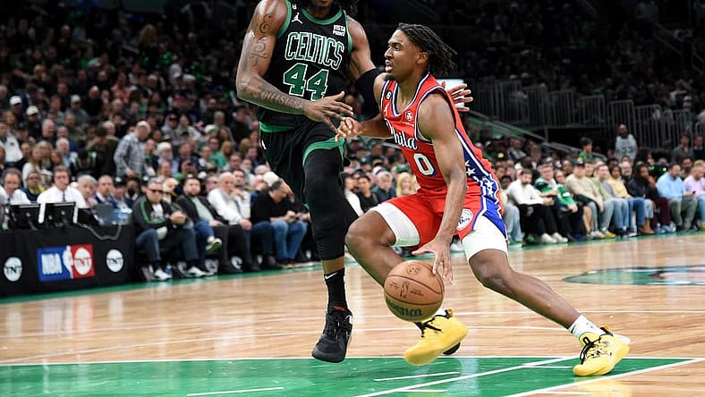 May 1, 2023; Boston, Massachusetts, USA; Philadelphia 76ers guard Tyrese Maxey (0) controls the ball while Boston Celtics center Robert Williams III (44) defends in the first half during game one of the 2023 NBA playoffs at TD Garden. Mandatory Credit: Bob DeChiara-USA TODAY Sports