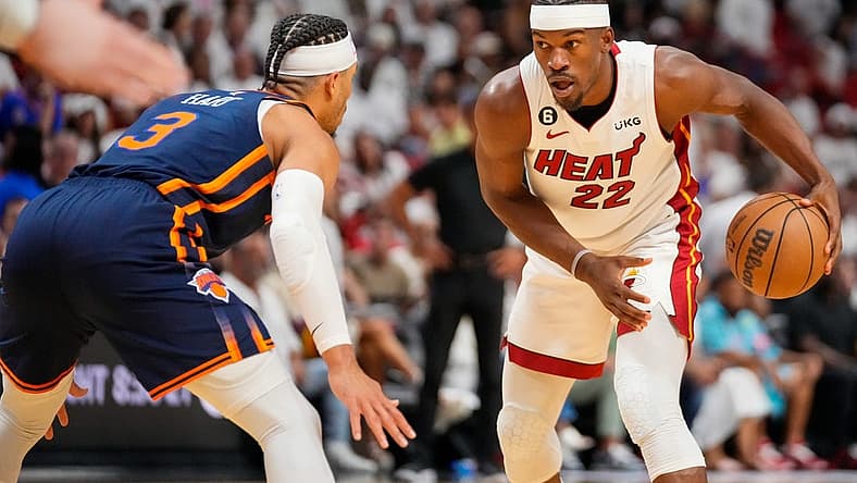 May 6, 2023; Miami, Florida, USA; Miami Heat forward Jimmy Butler (22) looks to dribble the ball as New York Knicks guard Miles McBride (2) defends during the second half of game three of the 2023 NBA playoffs at Kaseya Center. Mandatory Credit: Rich Storry-USA TODAY Sports
