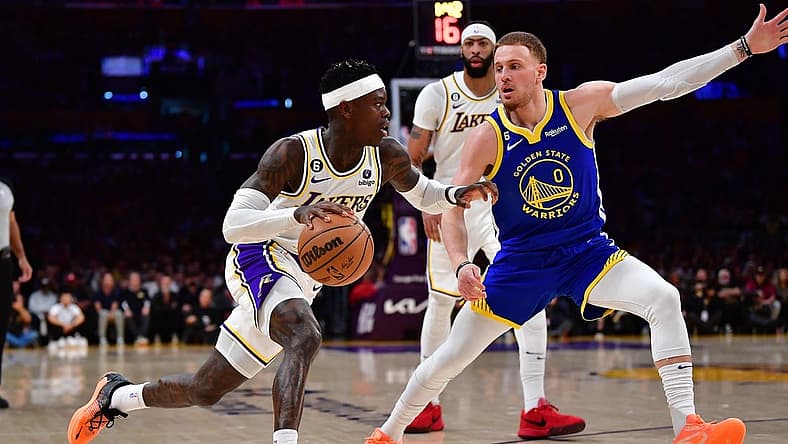 May 6, 2023; Los Angeles, California, USA; Los Angeles Lakers guard Dennis Schroder (17) moves the ball against Golden State Warriors guard Donte DiVincenzo (0) during the first half in game three of the 2023 NBA playoffs at Crypto.com Arena. Mandatory Credit: Gary A. Vasquez-USA TODAY Sports