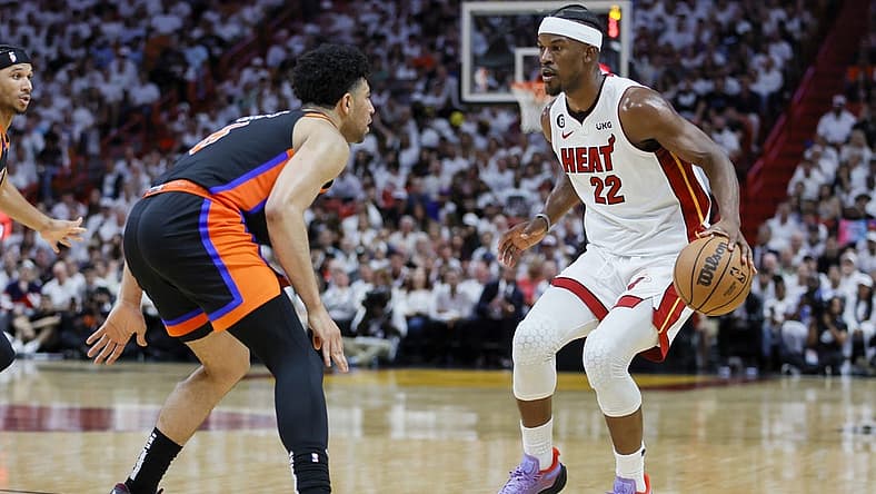 May 8, 2023; Miami, Florida, USA; Miami Heat forward Jimmy Butler (22) dribbles the basketball as New York Knicks guard Quentin Grimes (6) defends in the third quarter during game four of the 2023 NBA playoffs at Kaseya Center. Mandatory Credit: Sam Navarro-USA TODAY Sports