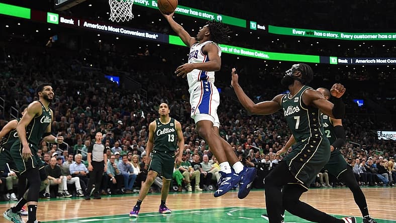 May 9, 2023; Boston, Massachusetts, USA; Philadelphia 76ers guard Tyrese Maxey (0) lays the ball in the basket past Boston Celtics guard Jaylen Brown (7) in the first half during game five of the 2023 NBA playoffs at TD Garden. Mandatory Credit: Bob DeChiara-USA TODAY Sports