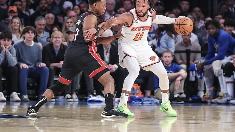 May 10, 2023; New York, New York, USA; New York Knicks guard Jalen Brunson (11) looks to drive past Miami Heat guard Kyle Lowry (7) during game five of the 2023 NBA playoffs at Madison Square Garden. Mandatory Credit: Wendell Cruz-USA TODAY Sports