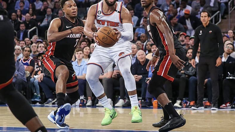 May 10, 2023; New York, New York, USA; New York Knicks guard Jalen Brunson (11) drives past Miami Heat guard Kyle Lowry (7) and forward Jimmy Butler (22) during game five of the 2023 NBA playoffs at Madison Square Garden. Mandatory Credit: Wendell Cruz-USA TODAY Sports