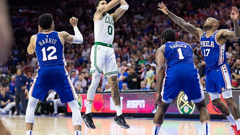May 11, 2023; Philadelphia, Pennsylvania, USA; Boston Celtics forward Jayson Tatum (0) shoots the ball against Philadelphia 76ers forward Tobias Harris (12) and forward P.J. Tucker (17) during the fourth quarter in game six of the 2023 NBA playoffs at Wells Fargo Center. Mandatory Credit: Bill Streicher-USA TODAY Sports