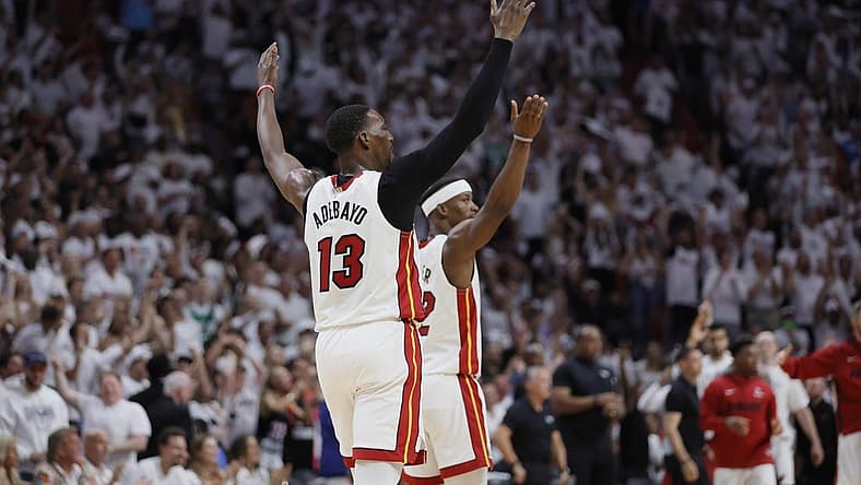 May 21, 2023; Miami, Florida, USA; Miami Heat center Bam Adebayo (13) and forward Jimmy Butler (22) react after a play during the third quarter against the Boston Celtics in game three of the Eastern Conference Finals for the 2023 NBA playoffs at Kaseya Center. Mandatory Credit: Sam Navarro-USA TODAY Sports