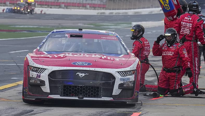 May 29, 2023; Concord, North Carolina, USA; NASCAR Cup Series driver Chase Briscoe (14) leaves his pits after a stop during the Coca-Cola 600 at Charlotte Motor Speedway. Mandatory Credit: Jim Dedmon-USA TODAY Sports