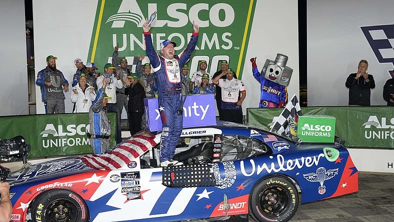 May 29, 2023; Concord, North Carolina, USA; NASCAR Xfinity Series driver Justin Allgaier (7) celebrates his win during the Alsco Uniforms 300 at Charlotte Motor Speedway. Mandatory Credit: Jim Dedmon-USA TODAY Sports