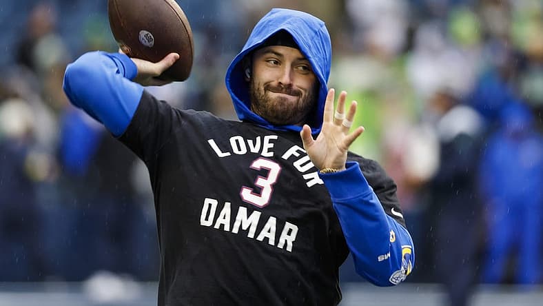 Jan 8, 2023; Seattle, Washington, USA; Los Angeles Rams quarterback Baker Mayfield (17) participates in early pregame warmups against the Seattle Seahawks while wearing a Love for Damar t-shirt in honor of Buffalo Bills safety Damar Hamlin (3, not pictured) at Lumen Field. Mandatory Credit: Joe Nicholson-USA TODAY Sports