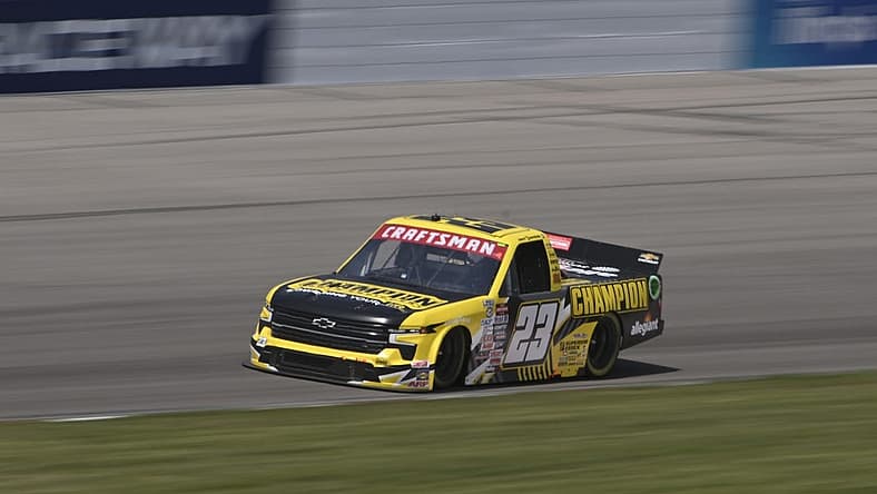 Jun 3, 2023; Madison, Illinois, USA; NASCAR Craftsman Truck Series Grant Enfinger (23) races during the Truck Series Toyota 200 at World Wide Technology Raceway. Mandatory Credit: Joe Puetz-USA TODAY Sports