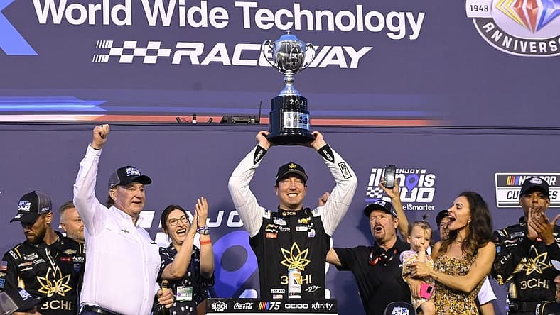 Jun 4, 2023; Madison, Illinois, USA; NASCAR Cup Series driver Kyle Busch (8) and his team pose for a photo after winning the Enjoy Illinois 300 at World Wide Technology Raceway. Mandatory Credit: Joe Puetz-USA TODAY Sports