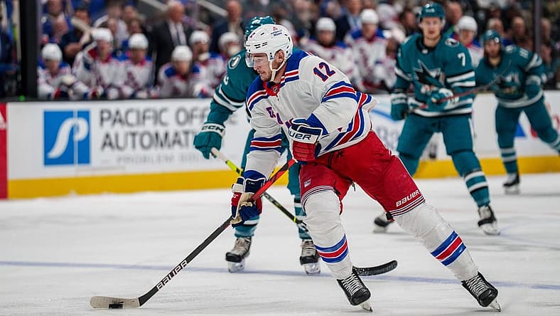 Nov 19, 2022; San Jose, California, USA; New York Rangers right wing Julien Gauthier (12) skates with the puck during the first period against the San Jose Sharks at SAP Center at San Jose. Mandatory Credit: Neville E. Guard-USA TODAY Sports