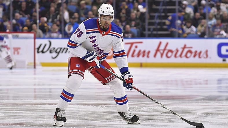 Mar 31, 2023; Buffalo, New York, USA; New York Rangers defenseman K'Andre Miller (79) handles the puck in the first period against the Buffalo Sabres at KeyBank Center. Mandatory Credit: Mark Konezny-USA TODAY Sports