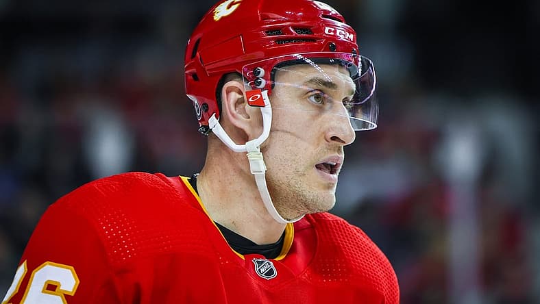 Apr 2, 2023; Calgary, Alberta, CAN; Calgary Flames defenseman Michael Stone (26) skates against the Anaheim Ducks during the third period at Scotiabank Saddledome. Mandatory Credit: Sergei Belski-USA TODAY Sports