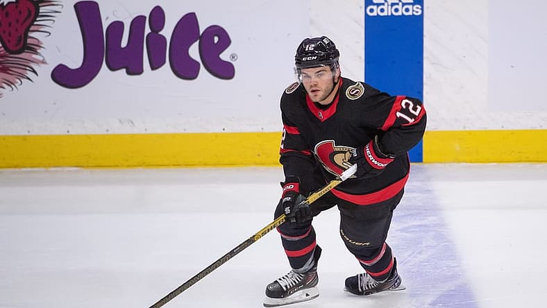 Apr 10, 2023; Ottawa, Ontario, CAN; Ottawa Senators right wing Alex DeBrincat (12) skates with the puck in the third period against the Carolina Hurricanes at the Canadian Tire Centre. Mandatory Credit: Marc DesRosiers-USA TODAY Sports