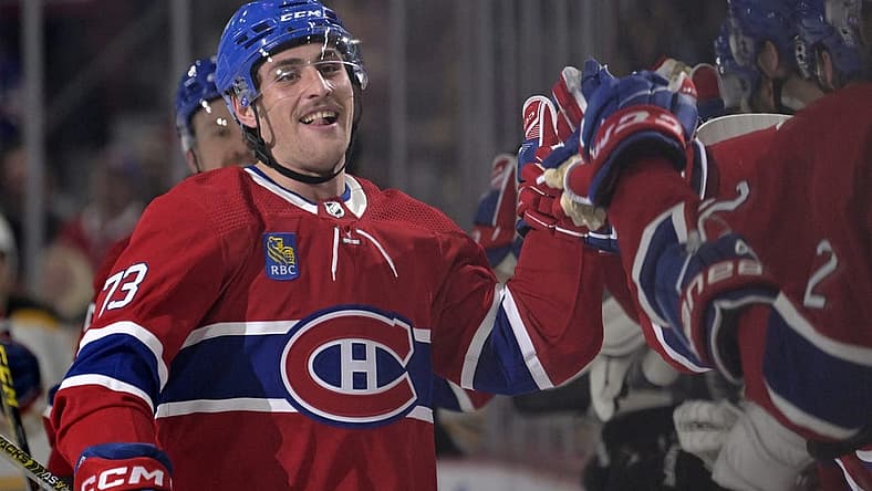 Apr 13, 2023; Montreal, Quebec, CAN; Montreal Canadiens forward Lucas Condotta (73) celebrates with teammates after scoring his first NHL goal during the first period of the game against the Boston Bruins at the Bell Centre. Mandatory Credit: Eric Bolte-USA TODAY Sports