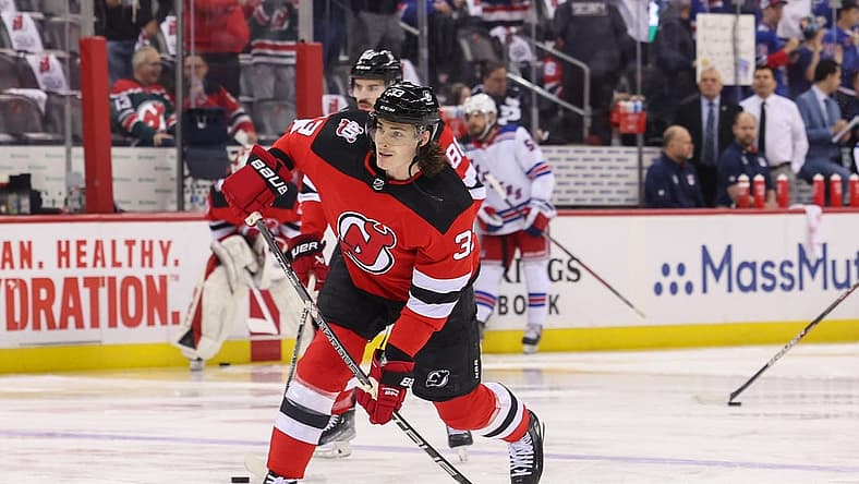 Apr 20, 2023; Newark, New Jersey, USA; New Jersey Devils defenseman Ryan Graves (33) shoots the puck during warmups against the New York Rangers before game two of the first round of the 2023 Stanley Cup Playoffs at Prudential Center. Mandatory Credit: Ed Mulholland-USA TODAY Sports