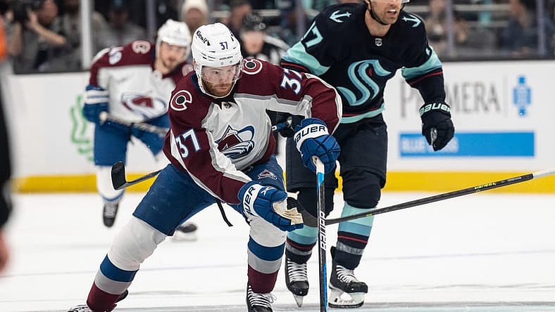 Apr 24, 2023; Seattle, Washington, USA; Colorado Avalanche forward J.T. Compher (37) skates with the puck against the Seattle Kraken in game four of the first round of the 2023 Stanley Cup Playoffs at Climate Pledge Arena. Mandatory Credit: Stephen Brashear-USA TODAY Sports