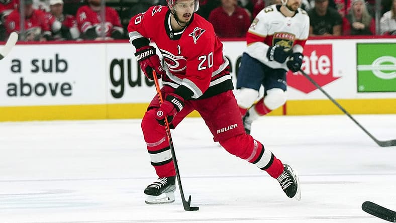 May 20, 2023; Raleigh, North Carolina, USA; Carolina Hurricanes center Sebastian Aho (20) pushes the puck up the ice against the Florida Panthers in game two of the Eastern Conference Finals of the 2023 Stanley Cup Playoffs at PNC Arena. Mandatory Credit: James Guillory-USA TODAY Sports