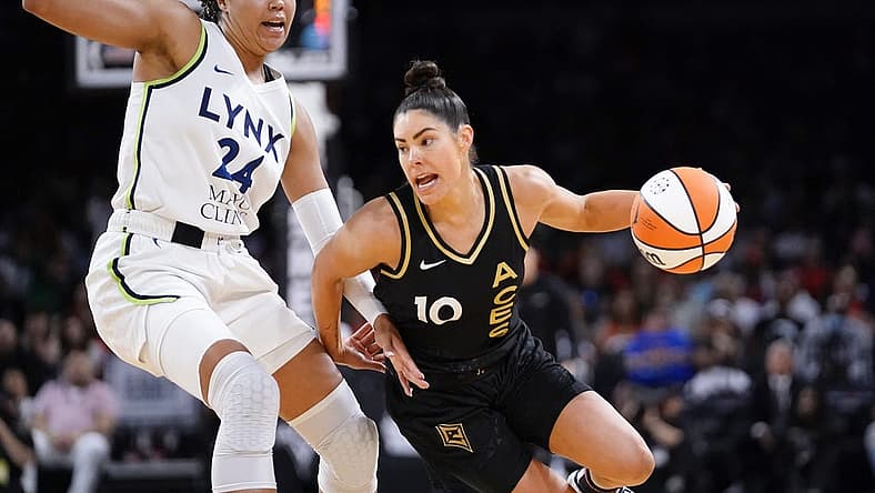 May 28, 2023; Las Vegas, Nevada, USA; Las Vegas Aces guard Kelsey Plum (10) drives the ball against Minnesota Lynx forward Napheesa Collier (24) during the third quarter at Michelob Ultra Arena. Mandatory Credit: Lucas Peltier-USA TODAY Sports