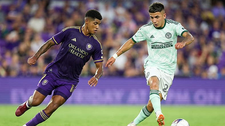 May 27, 2023; Orlando, Florida, USA; Atlanta United FC midfielder Thiago Almada (23) controls the ball from Orlando City SC midfielder Wilder Cartagena (16) in the first half at Exploria Stadium. Mandatory Credit: Nathan Ray Seebeck-USA TODAY Sports